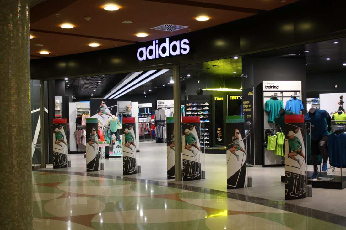 front of an adidas retail store